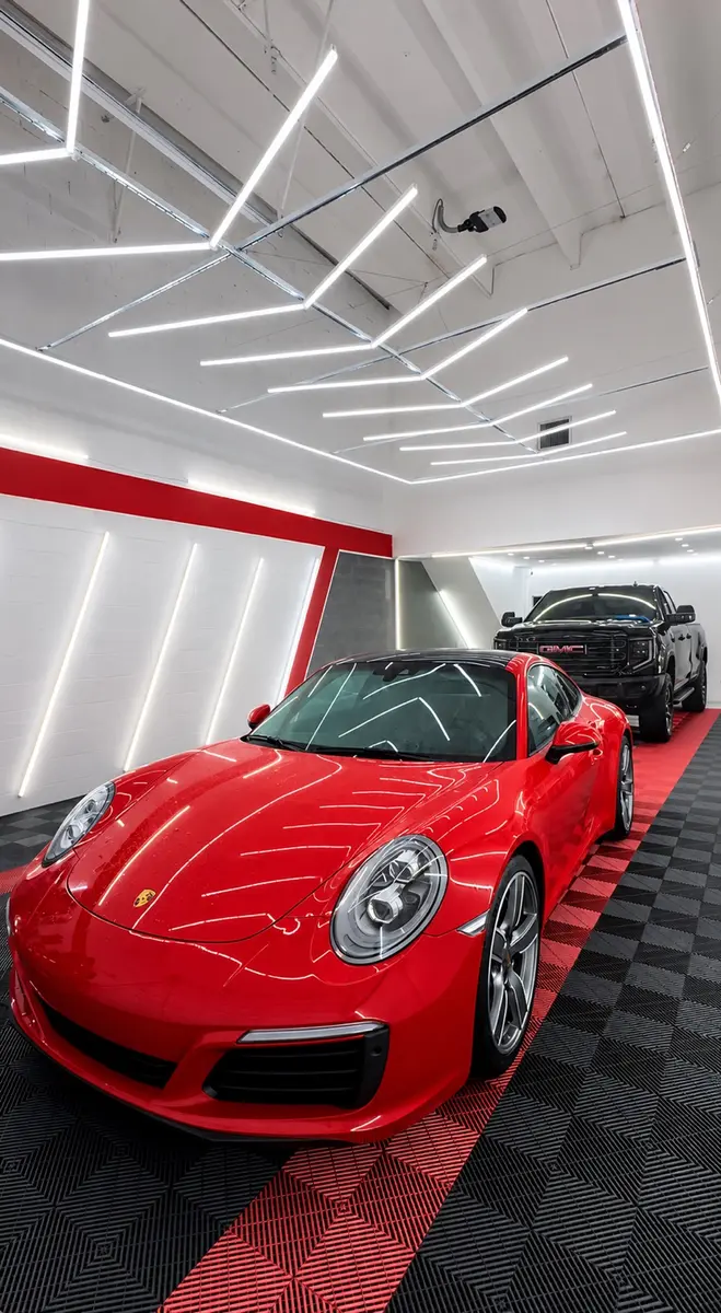 Red Porsche detailed inside a premium automotive studio