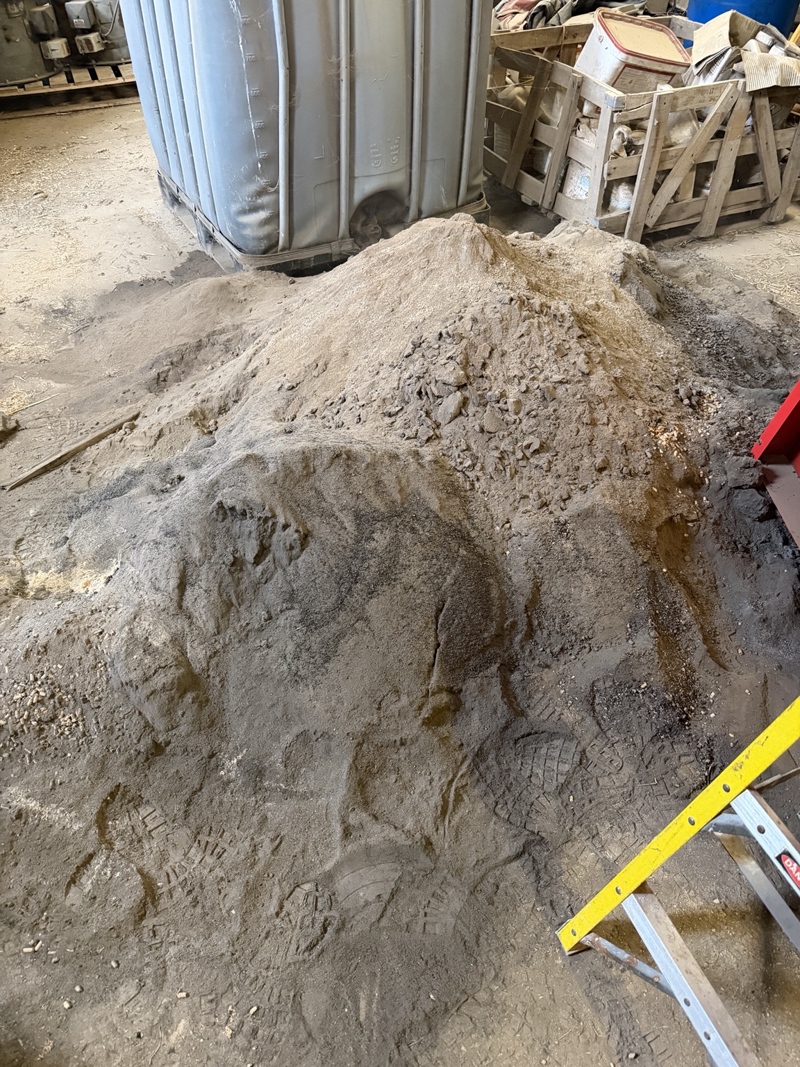 Large pile of ash and combustion residue removed during the biomass boiler service in Braithwaite
