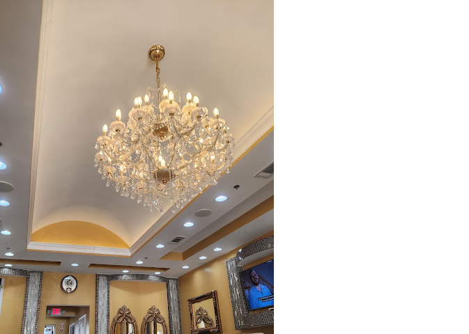 Lynn's Nails salon interior with crystal chandelier and pedicure chairs